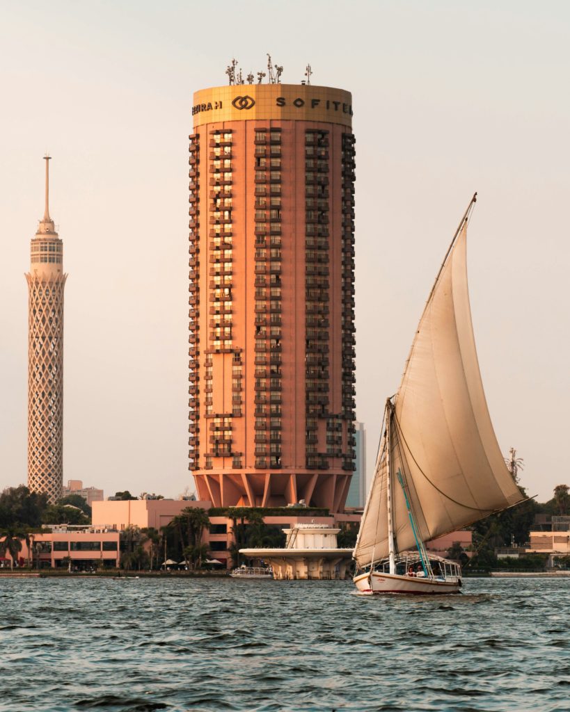 boat sailing the nile with Gezira Island in the background